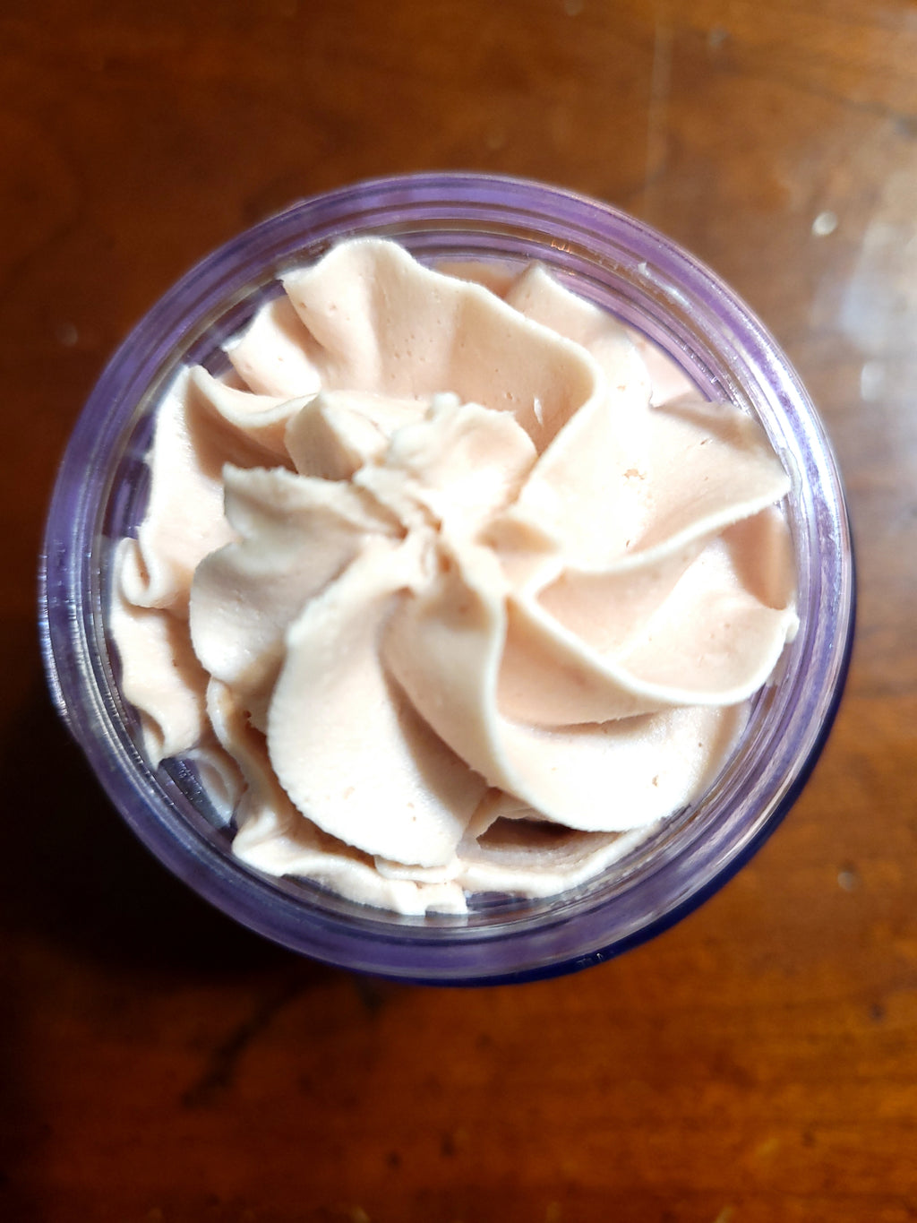 Close up of Organic Body Butter in reusable glass jar 
