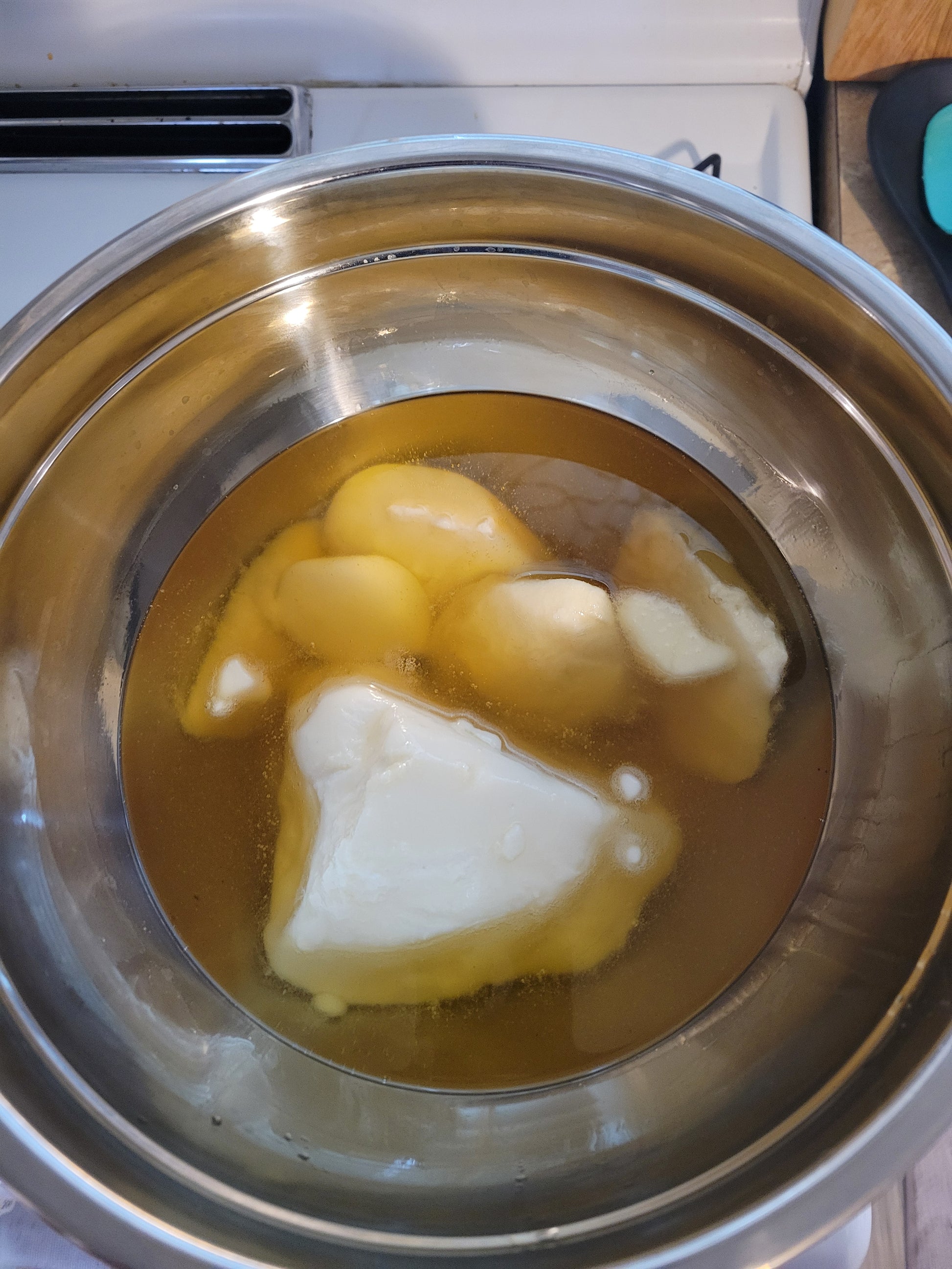 Mixing organic ingredients in Handcrafted body butter 